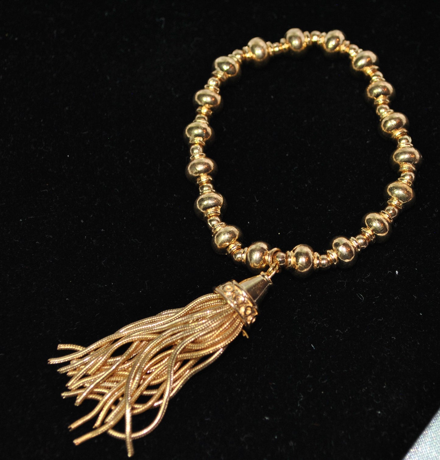 Yellow Gold Overlay Strand Stretch Tassel Bracelet